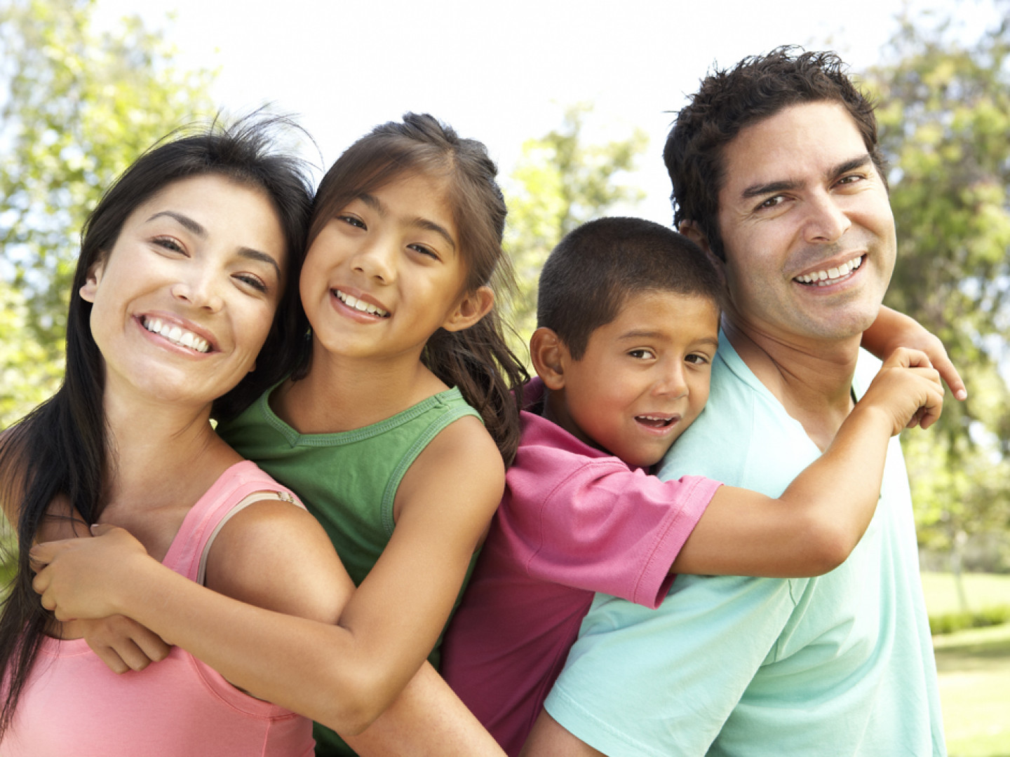 Young-Family-Having-Fun-In-Par